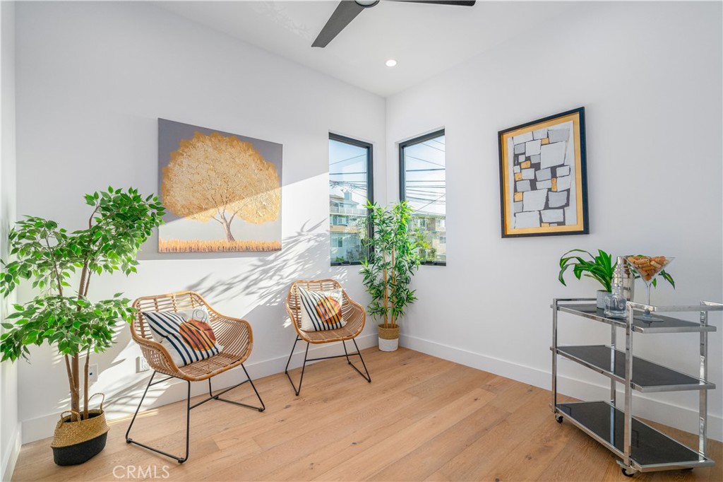2101 Rockefeller Lane Redondo Beach, CA 90278 - Photo 26 of 45 a living room with furniture and a potted plant