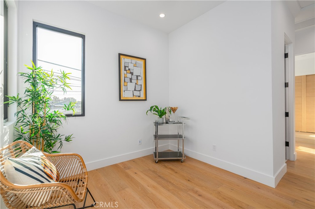 2101 Rockefeller Lane Redondo Beach, CA 90278 - Photo 27 of 45 a view of a workspace with furniture and a potted plant