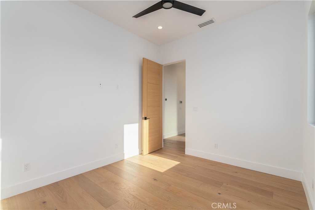 2101 Rockefeller Lane Redondo Beach, CA 90278 - Photo 31 of 45 an empty room with a empty space and a ceiling fan