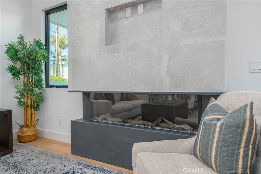 2101 Rockefeller Lane Redondo Beach, CA 90278 - Photo 9 of 45 a living room with furniture and a potted plant