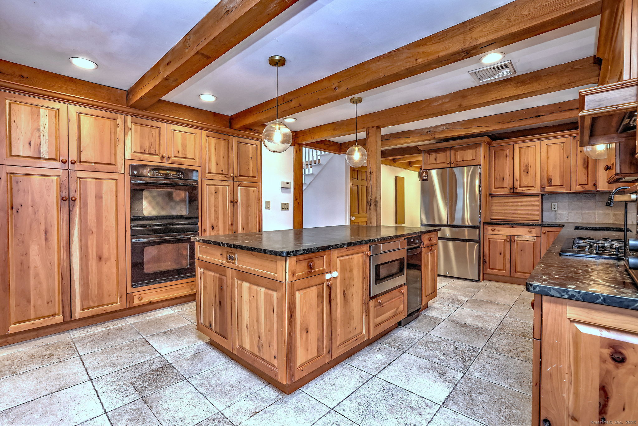24 Hickory Lane Roxbury, CT 06783 - Photo 12 of 40 a kitchen with stainless steel appliances granite countertop a stove and a refrigerator