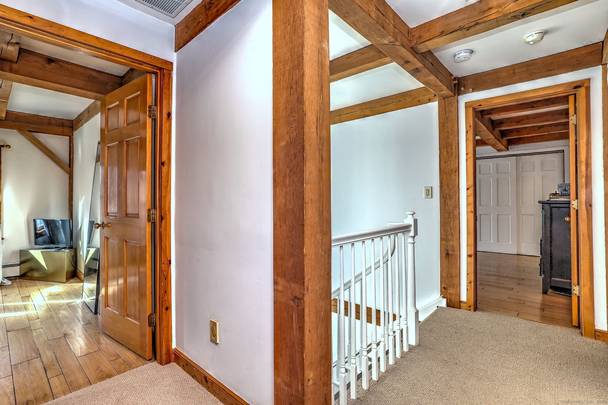 24 Hickory Lane Roxbury, CT 06783 - Photo 22 of 40 a view of a hallway with wooden floor and staircase