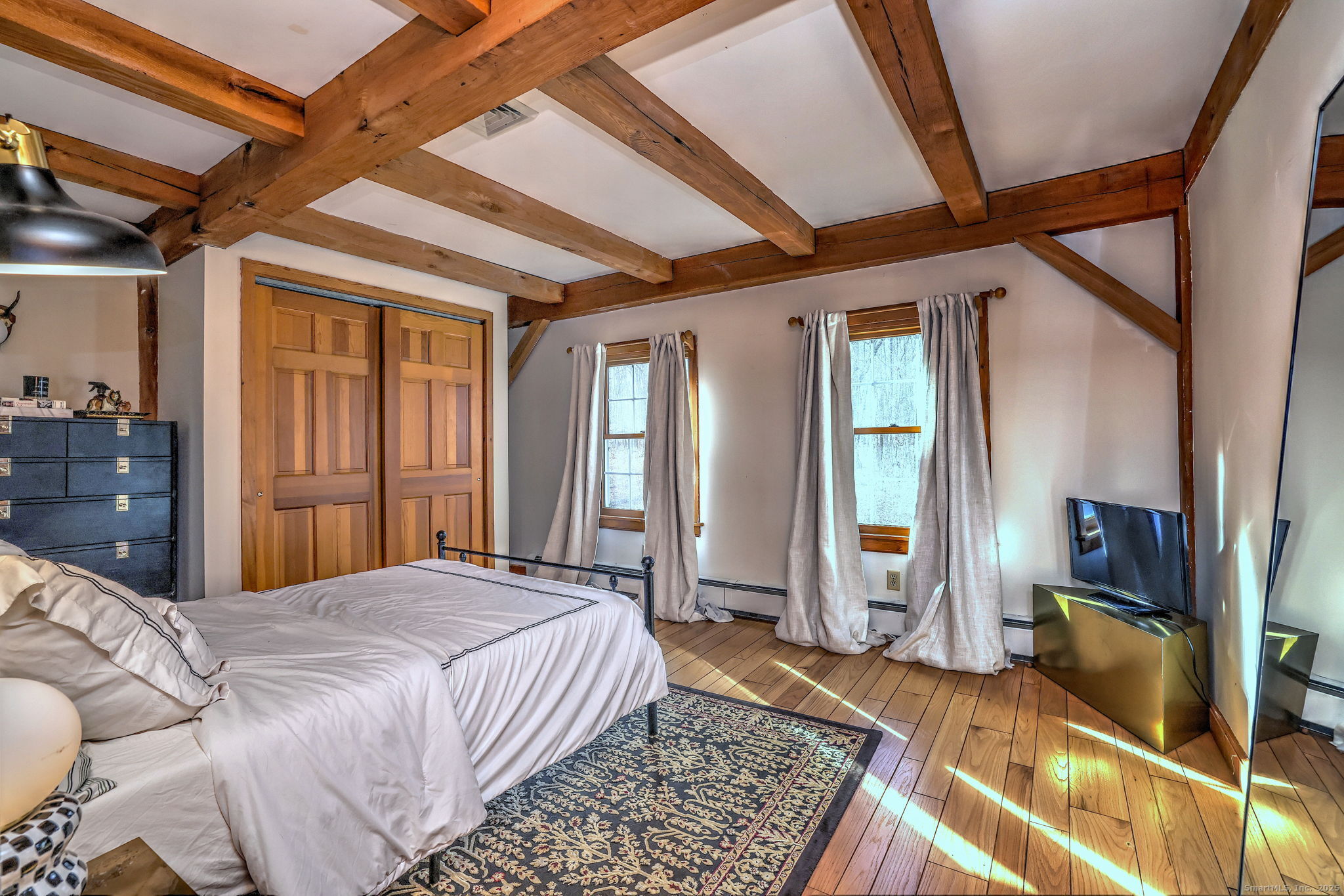 24 Hickory Lane Roxbury, CT 06783 - Photo 26 of 40 a bed sitting in a spacious bedroom next to a window