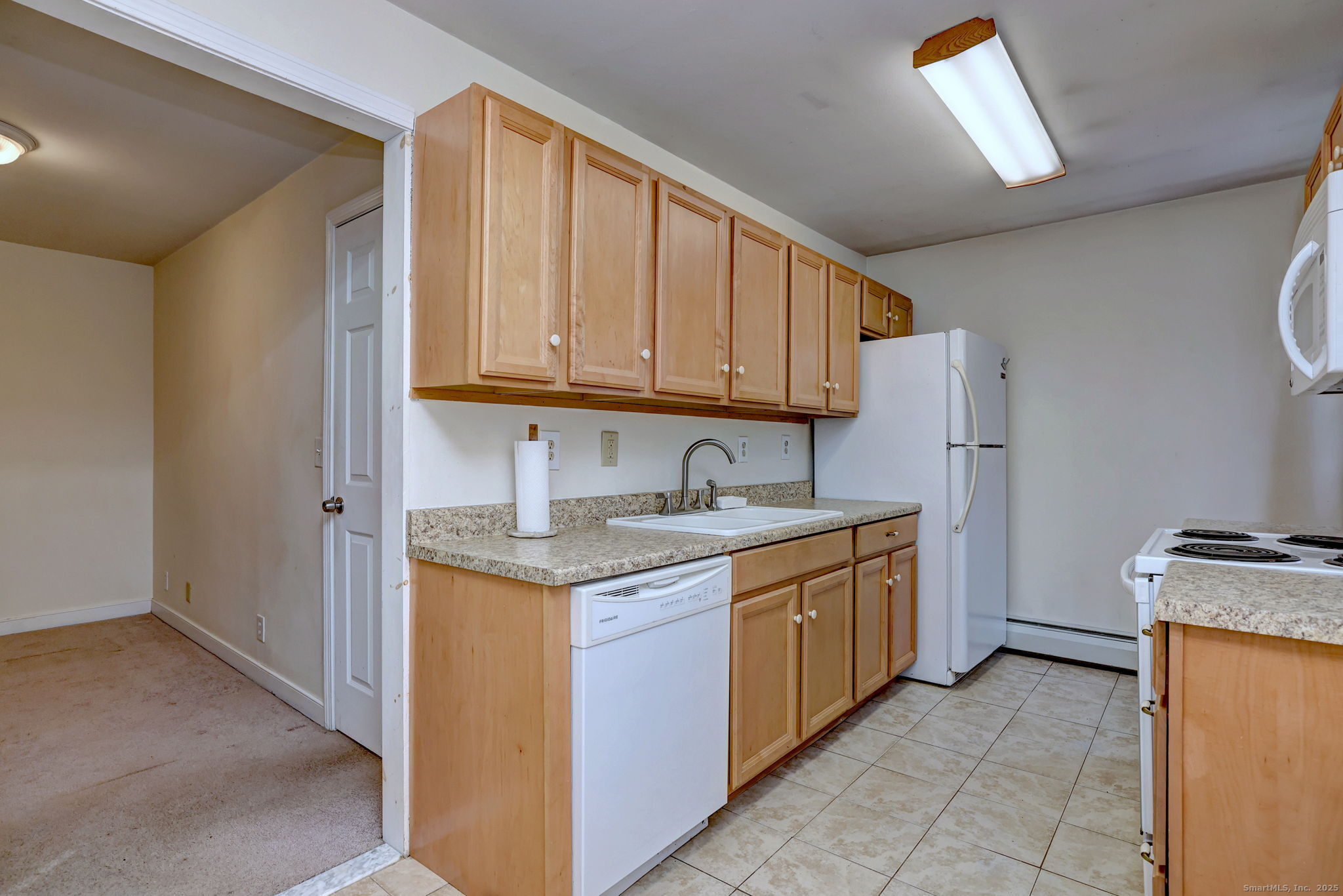 24 Hickory Lane Roxbury, CT 06783 - Photo 32 of 40 a kitchen with stainless steel appliances granite countertop a sink stove and refrigerator