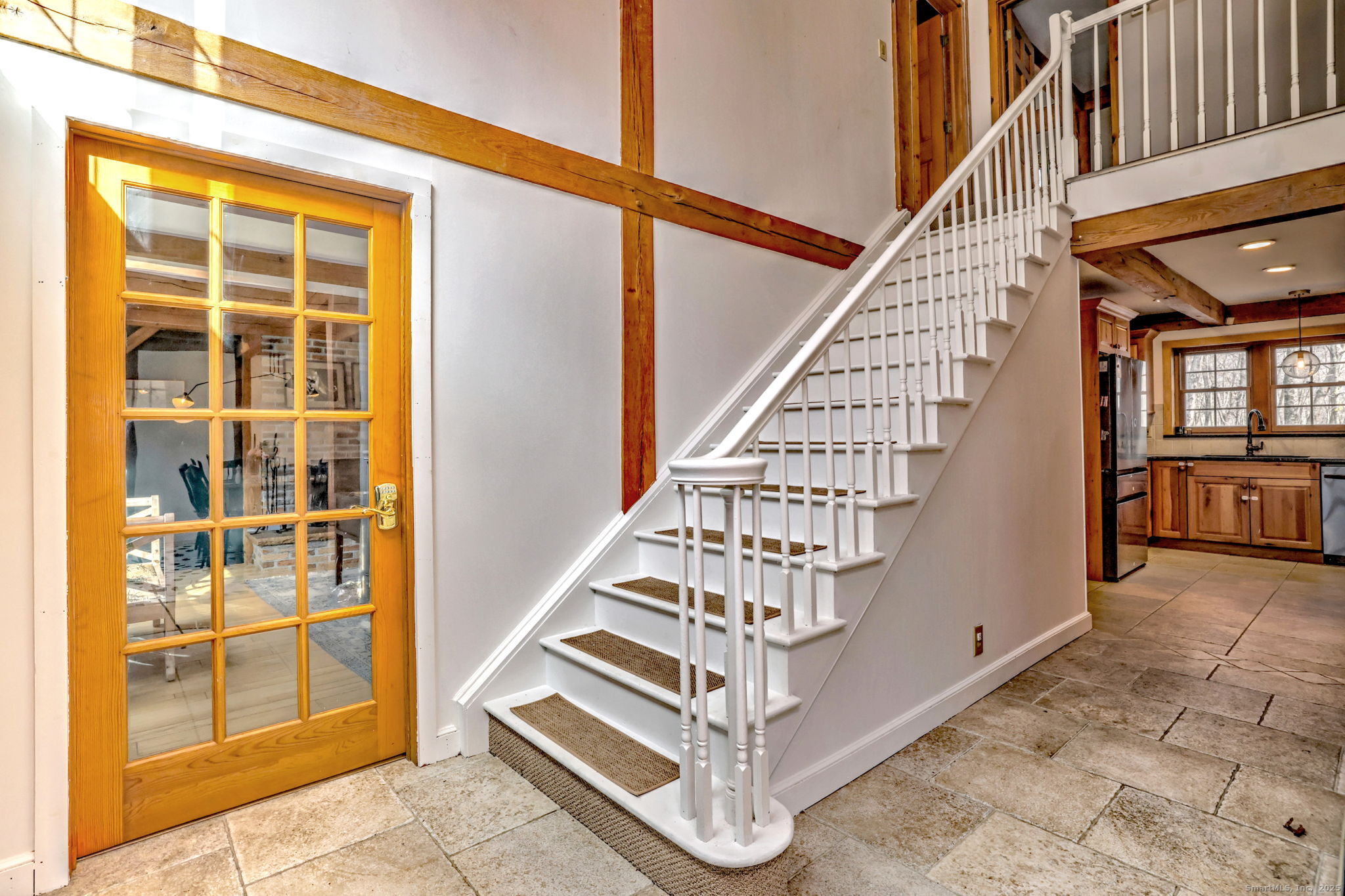 24 Hickory Lane Roxbury, CT 06783 - Photo 4 of 40 a view of entryway with wooden floor and windows