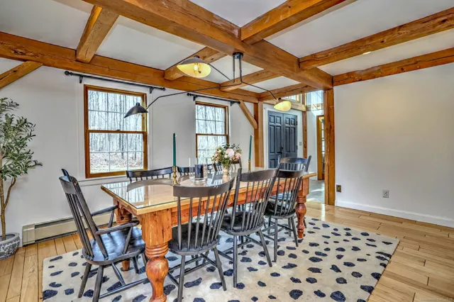 a view of a dining room with furniture and chandelier