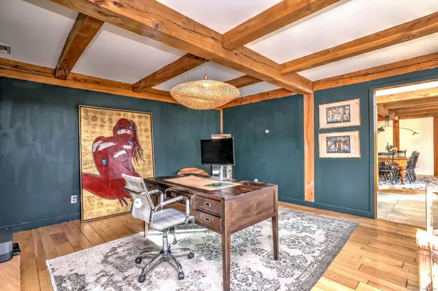 a workspace with furniture and window