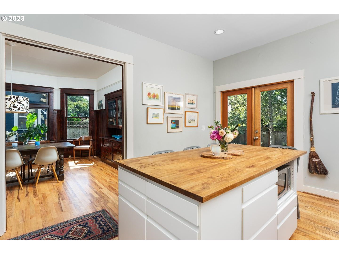 4027 North Colonial Avenue Portland, OR 97227 - Photo 14 of 47 a living room with dining table and wooden floor