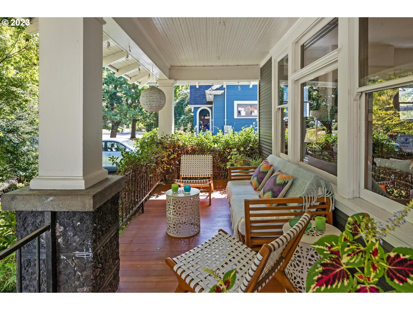 4027 North Colonial Avenue Portland, OR 97227 - Photo 24 of 47 a view of a porch with chairs and potted plants