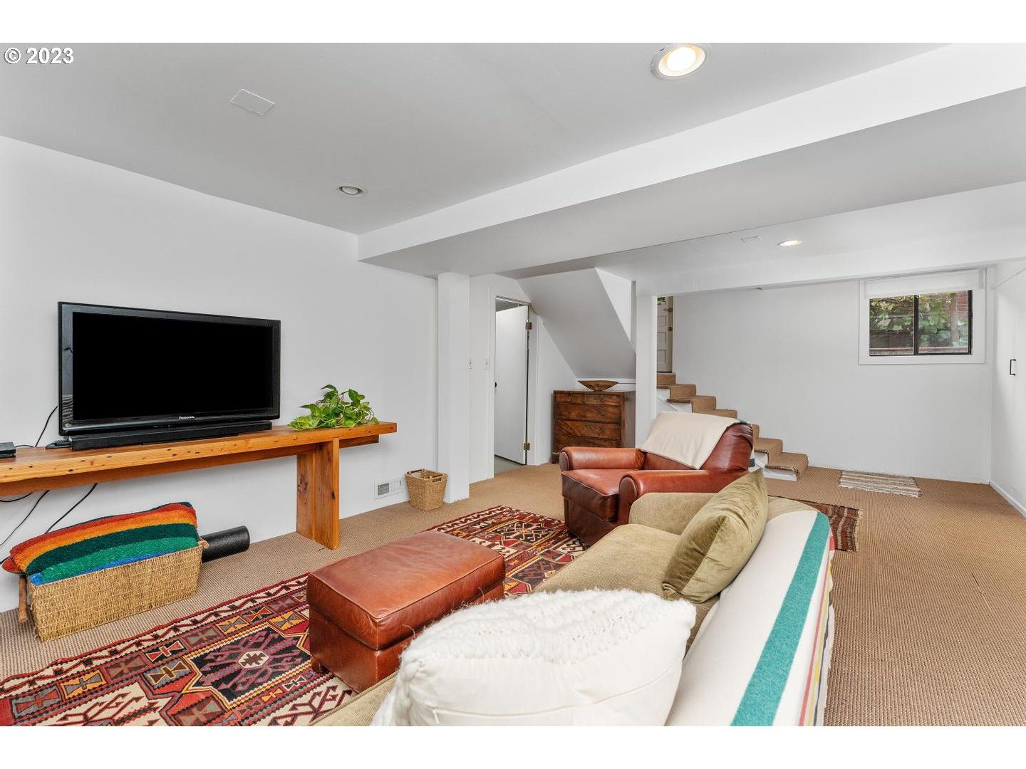 4027 North Colonial Avenue Portland, OR 97227 - Photo 27 of 47 a living room with furniture and a flat screen tv