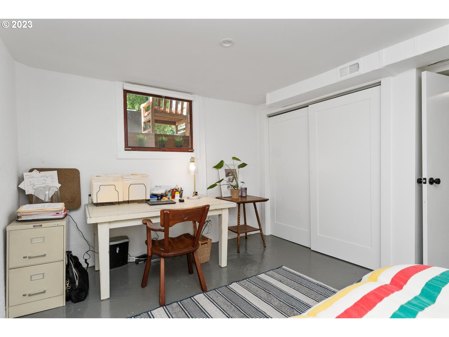 4027 North Colonial Avenue Portland, OR 97227 - Photo 30 of 47 a workspace with furniture and wooden floor