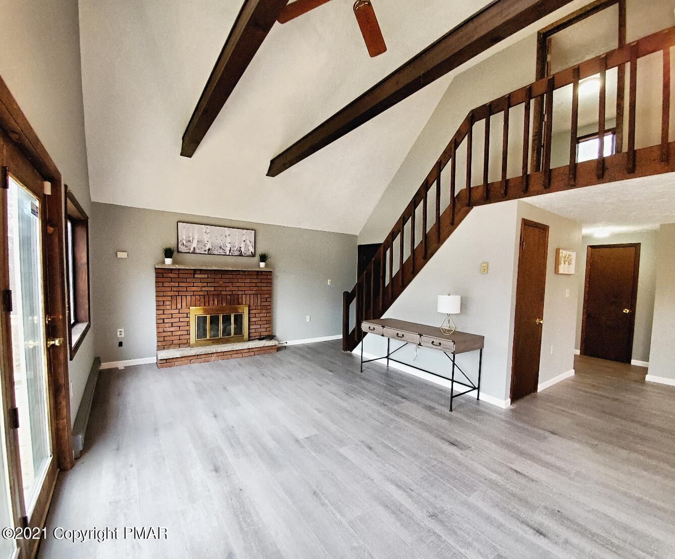 151 Granite Road Long Pond, PA 18334 - Photo 12 of 22 a view of an empty room with wooden floor and a window