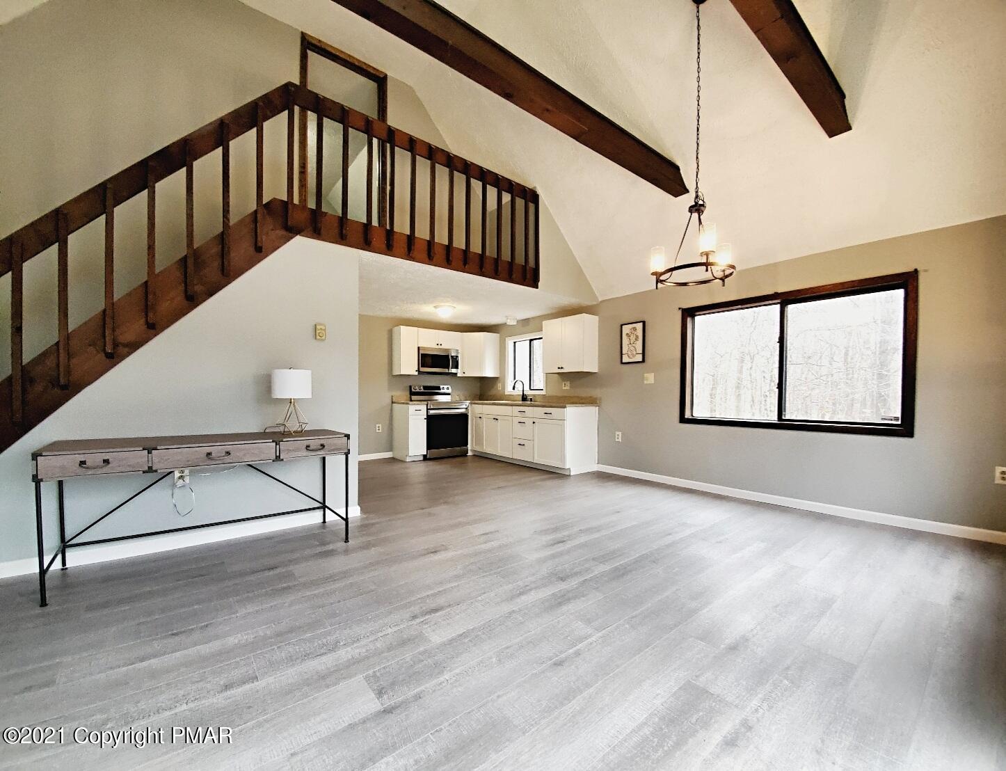 151 Granite Road Long Pond, PA 18334 - Photo 7 of 22 a view of entryway and hall with wooden floor