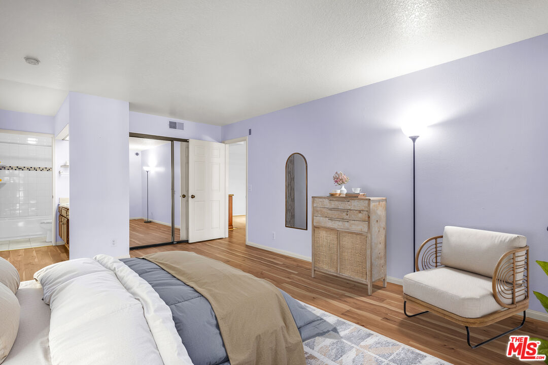 8512 Tuscany Avenue, Unit 207 Playa del Rey, CA 90293 - Photo 18 of 45 a bedroom with a bed and a couch