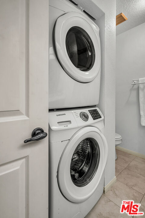 8512 Tuscany Avenue, Unit 207 Playa del Rey, CA 90293 - Photo 29 of 45 a utility room with dryer and washer