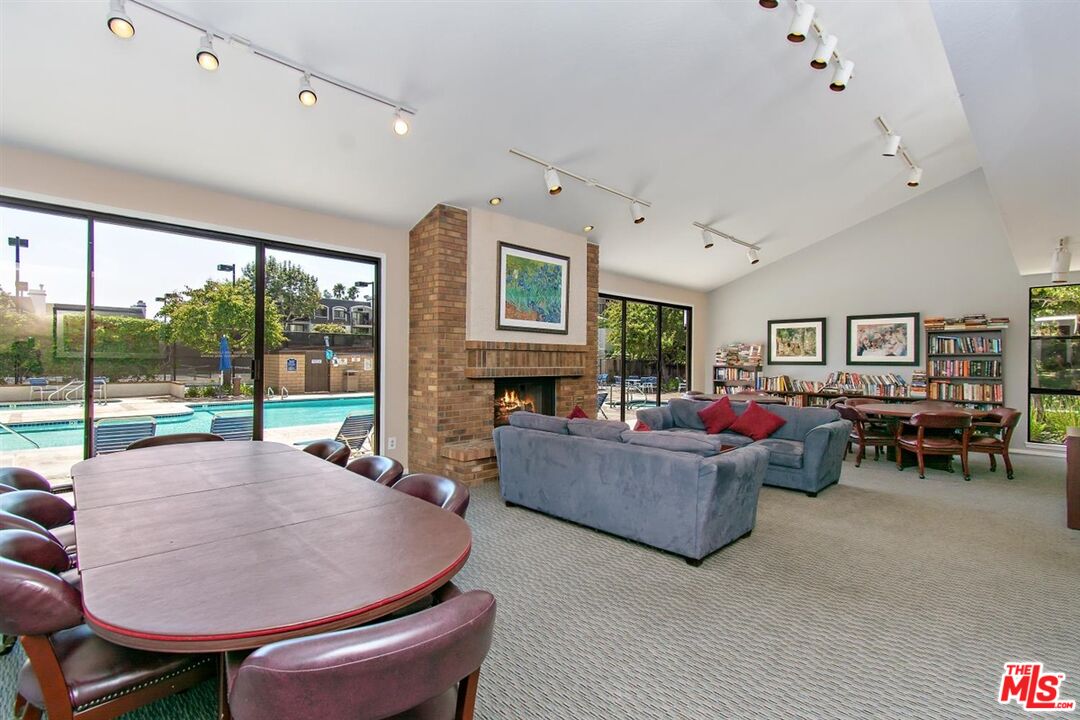 8512 Tuscany Avenue, Unit 207 Playa del Rey, CA 90293 - Photo 43 of 45 a living room with furniture and a fireplace
