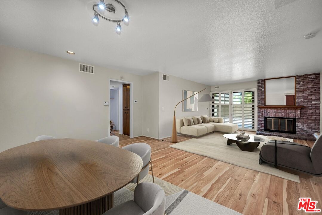 8512 Tuscany Avenue, Unit 207 Playa del Rey, CA 90293 - Photo 10 of 45 a living room with furniture