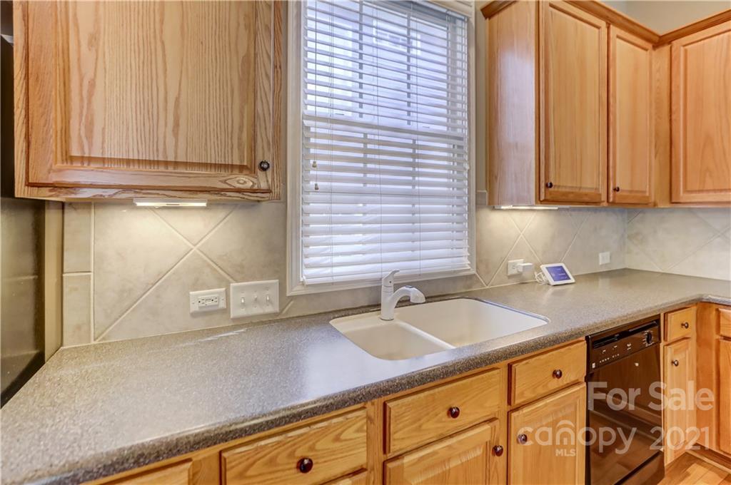 3229 Fifth Baxter Crossing Fort Mill, SC 29708 - Photo 18 of 46 a kitchen with stainless steel appliances granite countertop a sink and a cabinets