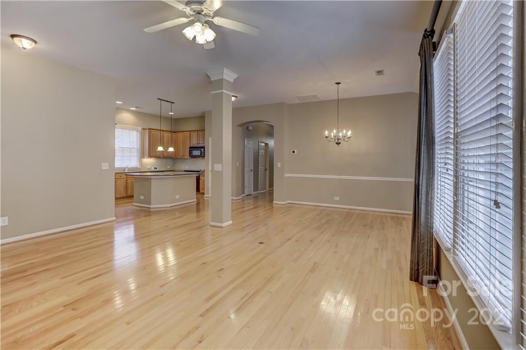 3229 Fifth Baxter Crossing Fort Mill, SC 29708 - Photo 20 of 46 a view of a livingroom with a furniture wooden floor and a window