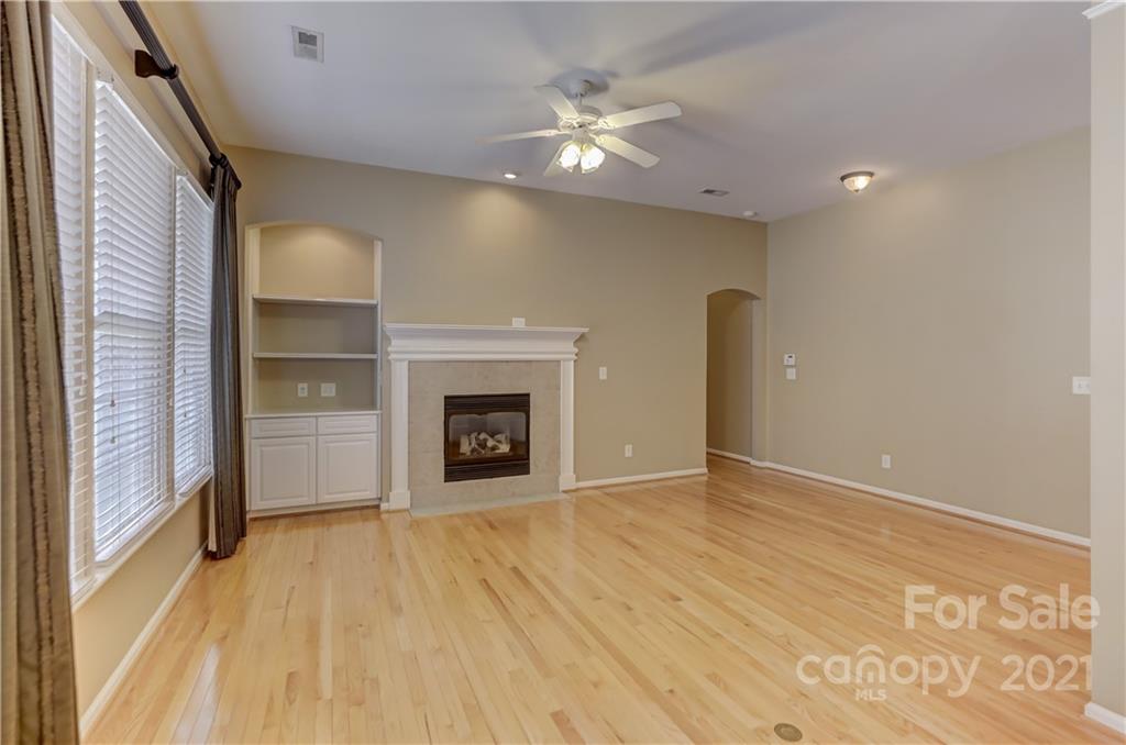 3229 Fifth Baxter Crossing Fort Mill, SC 29708 - Photo 21 of 46 a view of an empty room with a fireplace and a window