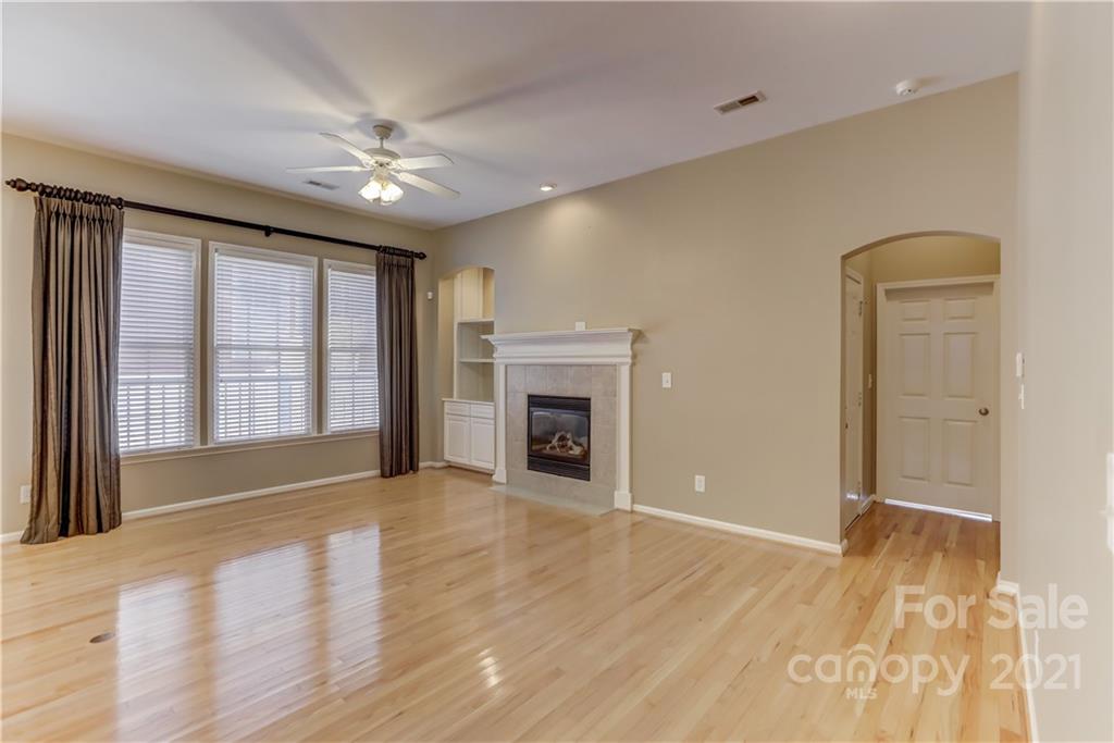 3229 Fifth Baxter Crossing Fort Mill, SC 29708 - Photo 22 of 46 a view of an empty room with a fireplace and a window