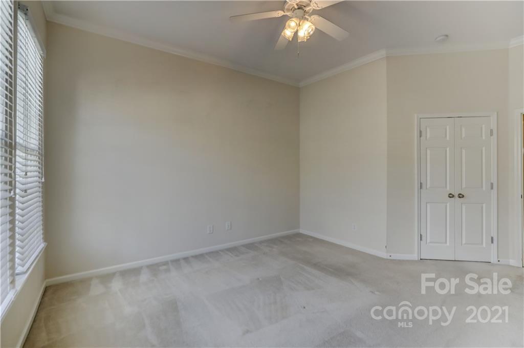3229 Fifth Baxter Crossing Fort Mill, SC 29708 - Photo 29 of 46 an empty room with a ceiling fan