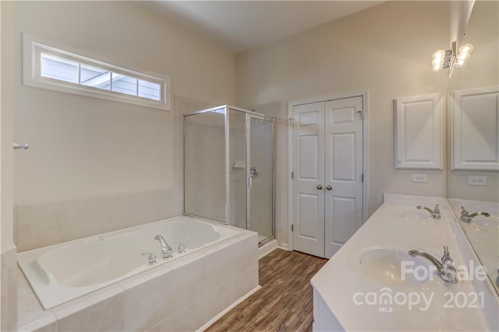 3229 Fifth Baxter Crossing Fort Mill, SC 29708 - Photo 30 of 46 a bathroom with a tub and a shower