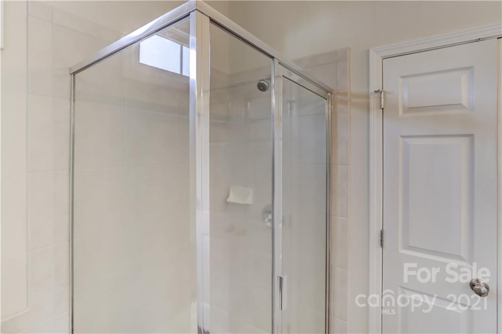 3229 Fifth Baxter Crossing Fort Mill, SC 29708 - Photo 31 of 46 a bathroom with a shower and a glass door