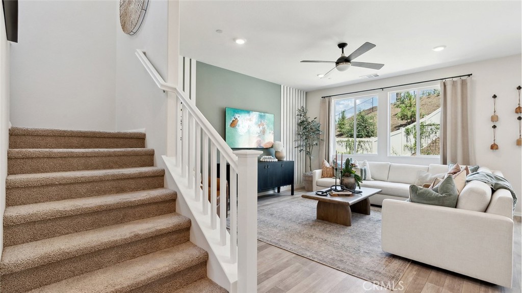 11392 Forge Road Corona, CA 92883 - Photo 12 of 24 a living room with furniture and a chandelier