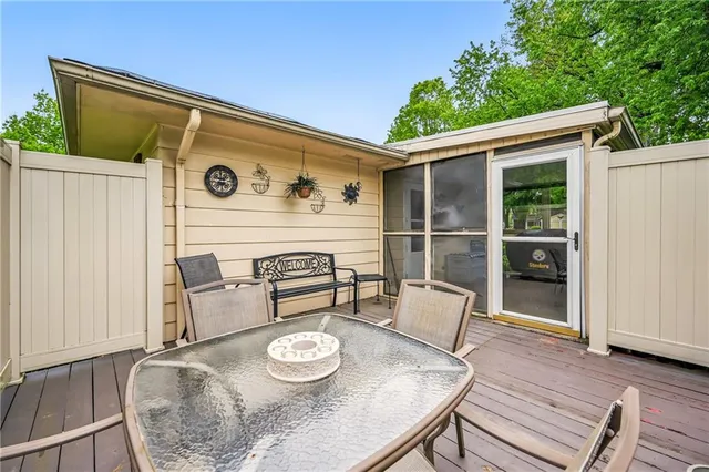 a view of table and chairs in patio