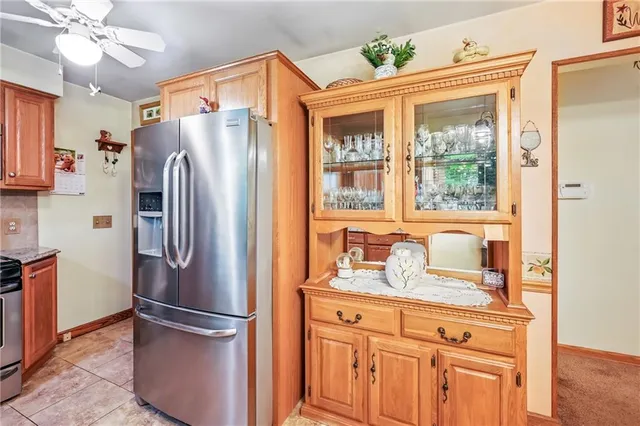 a kitchen with stainless steel appliances a refrigerator and cabinets