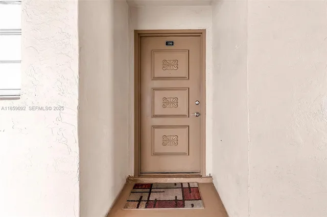 a view of a hallway with front door