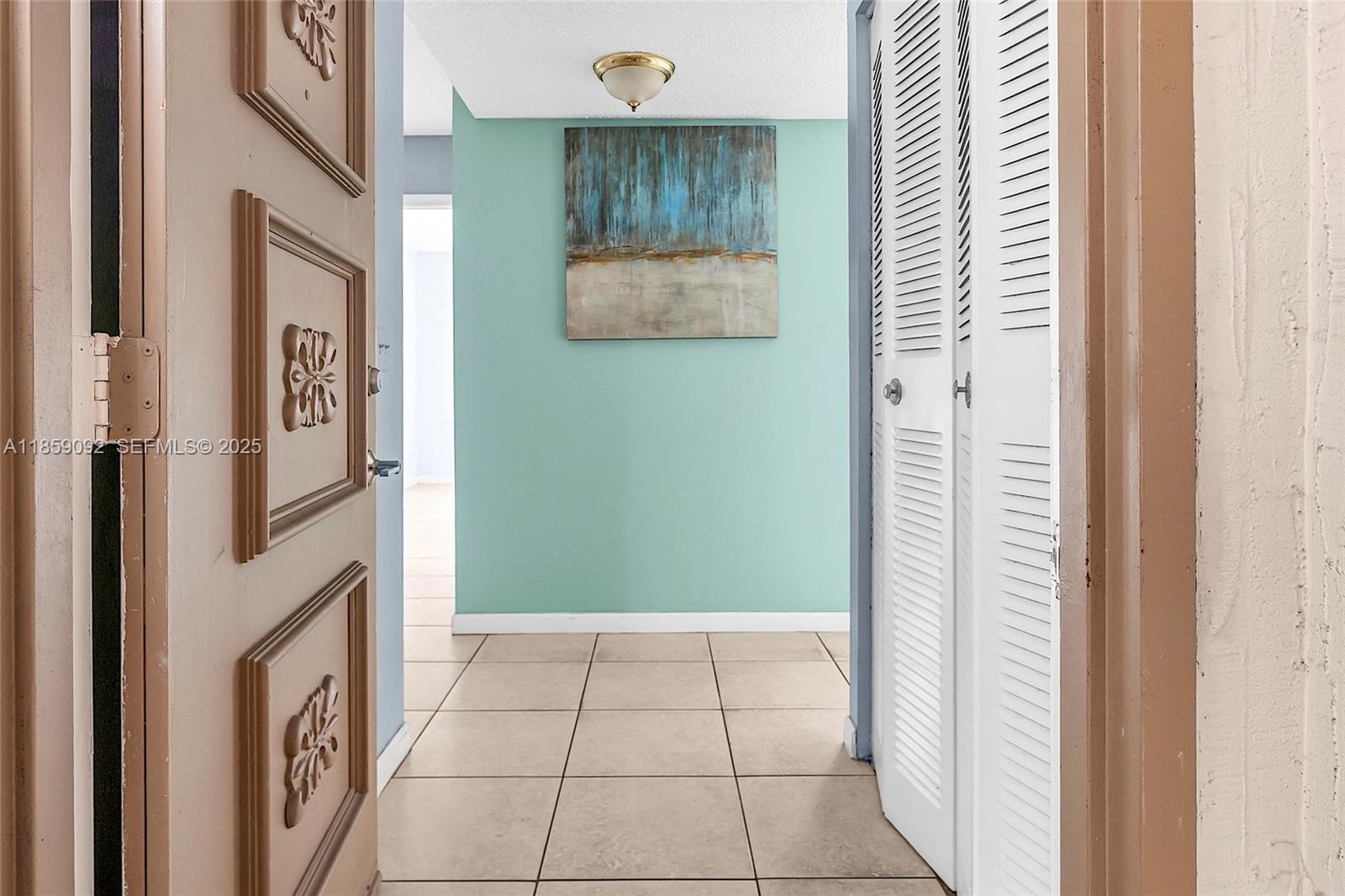 7747 Southwest 86th Street, Unit D106 Miami, FL 33143 - Photo 3 of 19 a bathroom with a bathtub and shower