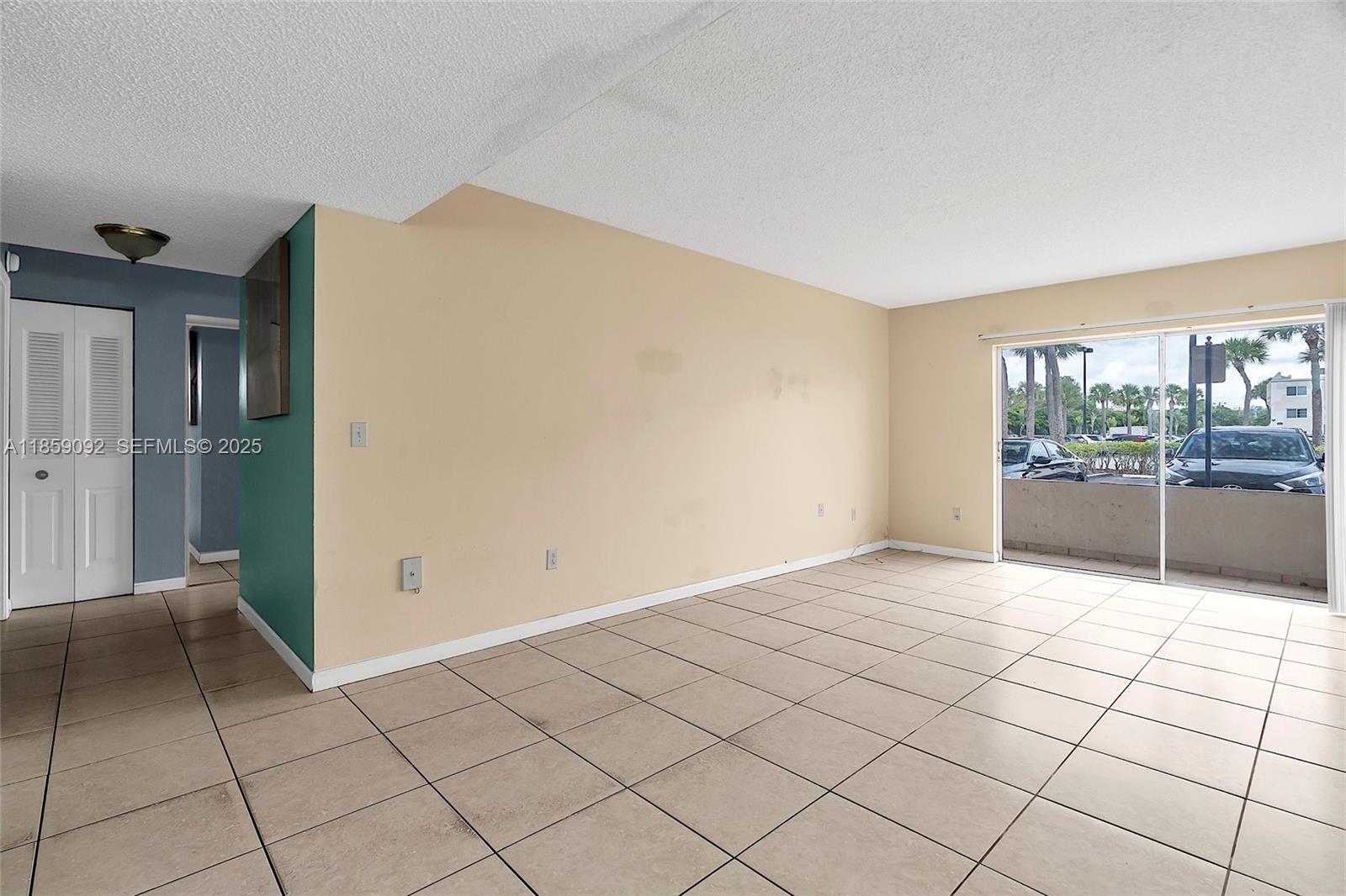 7747 Southwest 86th Street, Unit D106 Miami, FL 33143 - Photo 6 of 19 a view of an empty room and window
