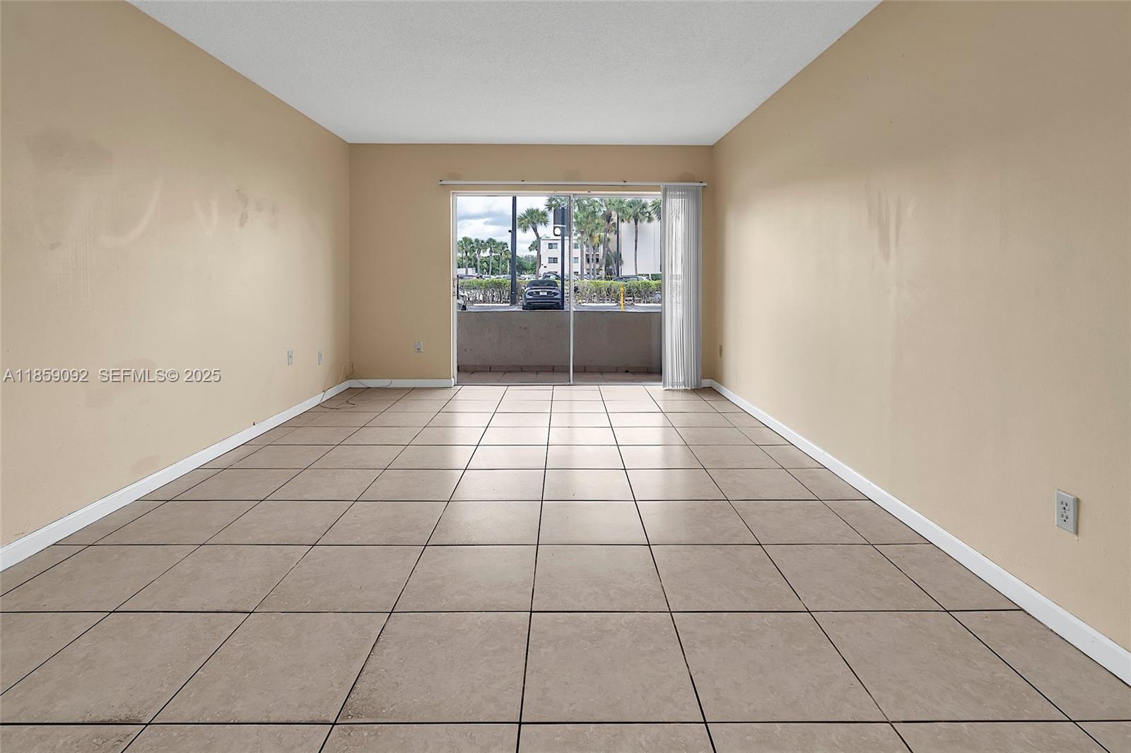 7747 Southwest 86th Street, Unit D106 Miami, FL 33143 - Photo 7 of 19 a view of an empty room and window