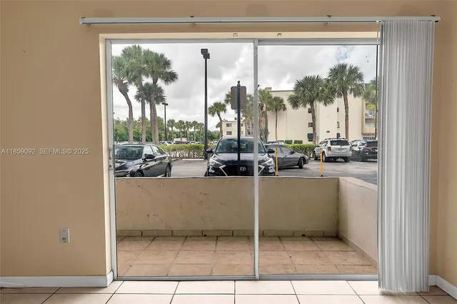 a view of open kitchen with window and outdoor space