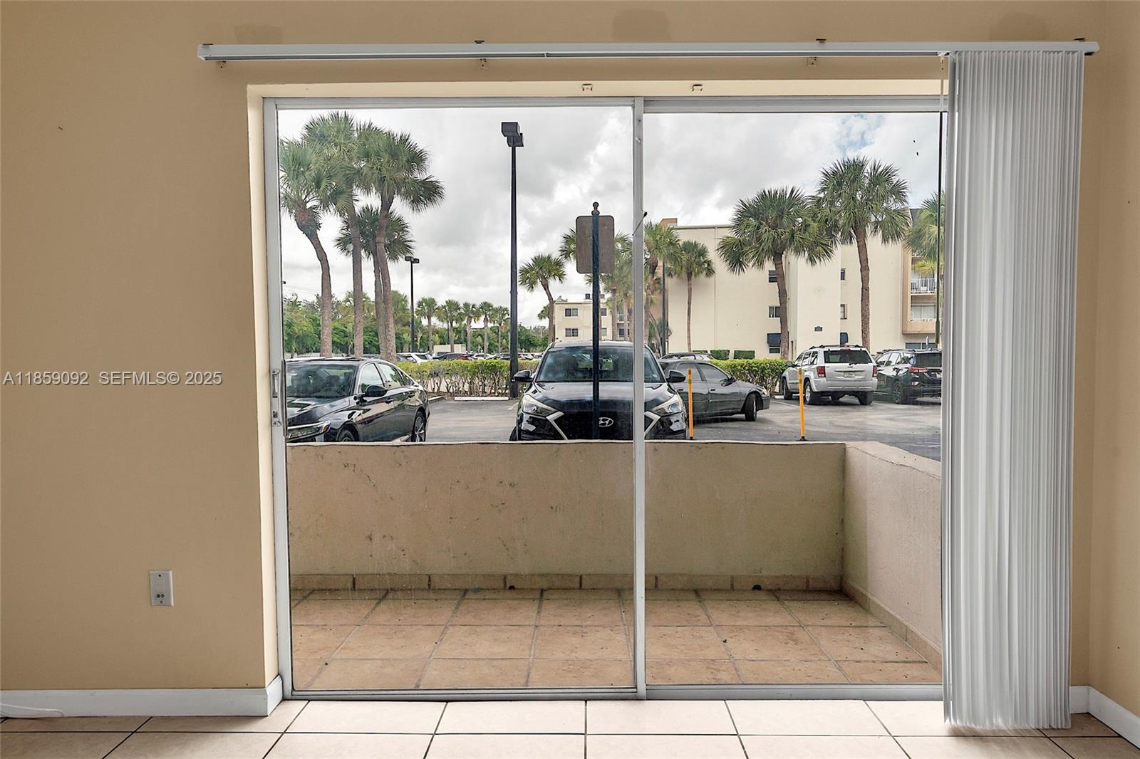 7747 Southwest 86th Street, Unit D106 Miami, FL 33143 - Photo 8 of 19 a view of open kitchen with window and outdoor space