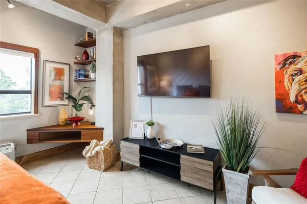 a kitchen with stainless steel appliances granite countertop a stove and a microwave