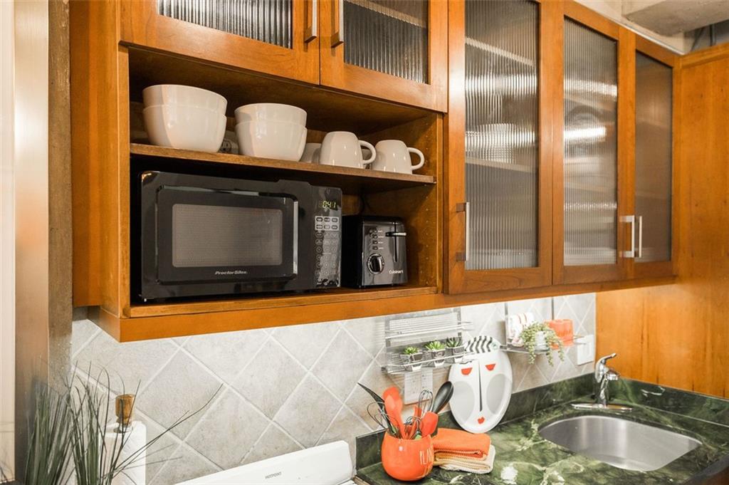 131 East Broad Street, Unit 503 Athens, GA 30601 - Photo 30 of 33 a bathroom with a sink and a mirror