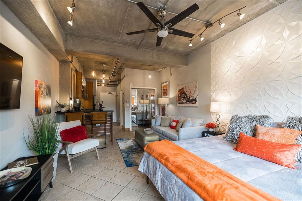 131 East Broad Street, Unit 503 Athens, GA 30601 - Photo 9 of 33 a bedroom with furniture and a bed