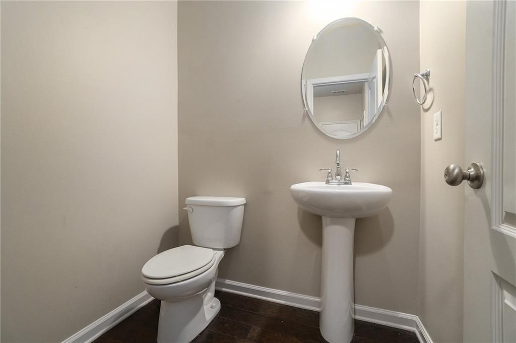 3989 Princeton Lakes Pass Southwest Atlanta, GA 30331 - Photo 11 of 25 a bathroom with a toilet sink and mirror