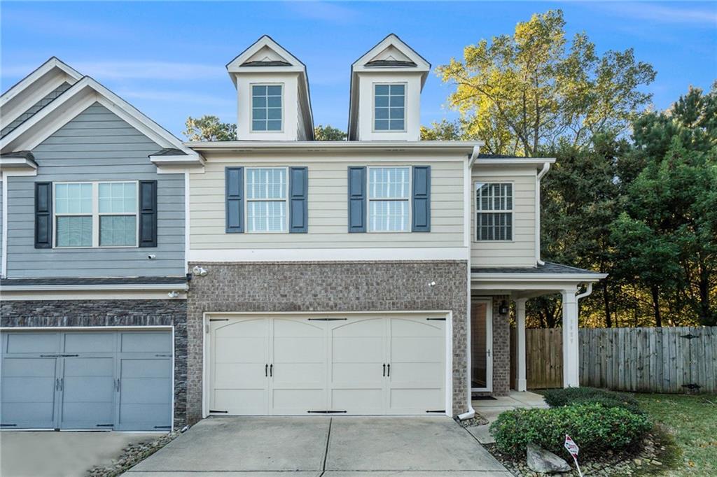 3989 Princeton Lakes Pass Southwest Atlanta, GA 30331 - Photo 3 of 25 a front view of a house with a yard