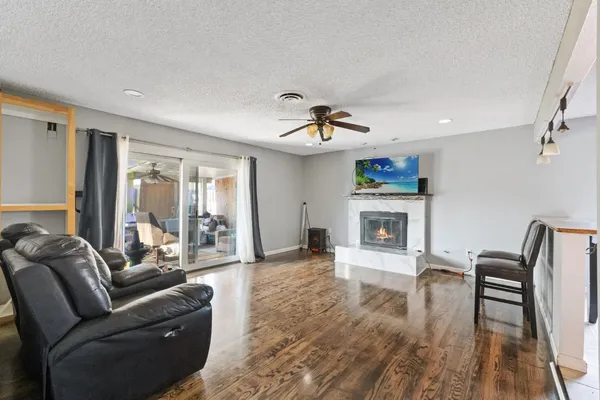 a living room with furniture and a fireplace