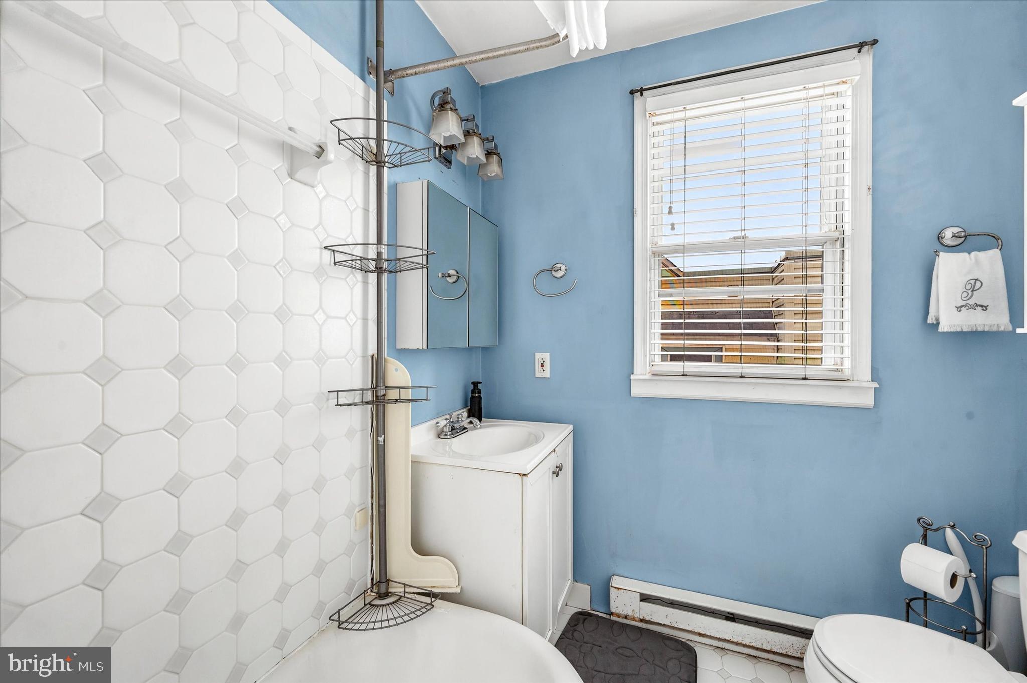 1210 Harding Drive Havertown, PA 19083 - Photo 18 of 25 a bathroom with a granite countertop toilet a sink a shower and a mirror