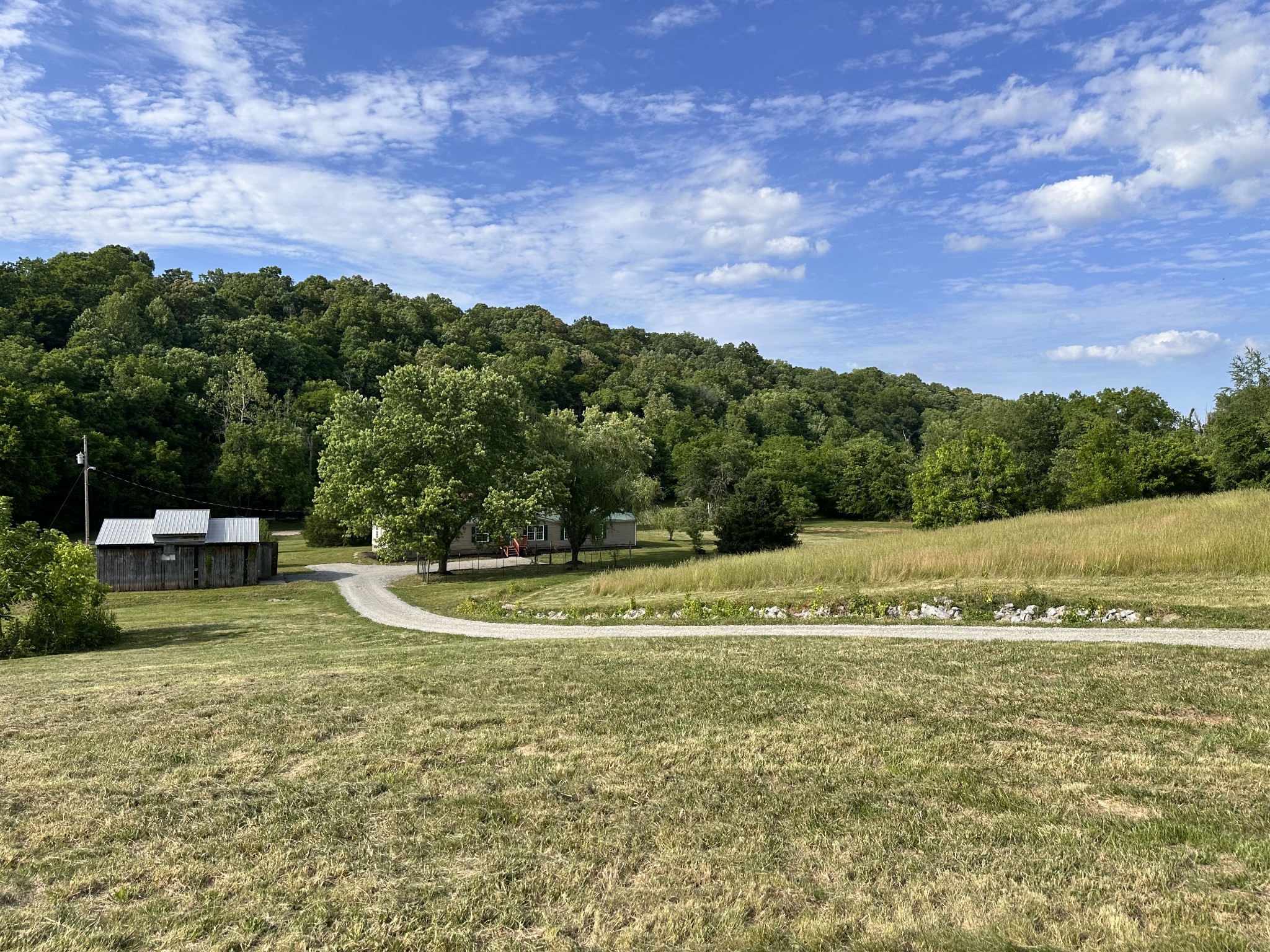 7287 Pinewood Road Nunnelly, TN 37137 - Photo 18 of 18 a view of a house with a big yard