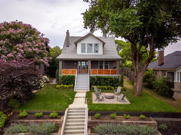 a view of a dining room with furniture a chandelier and wooden floor