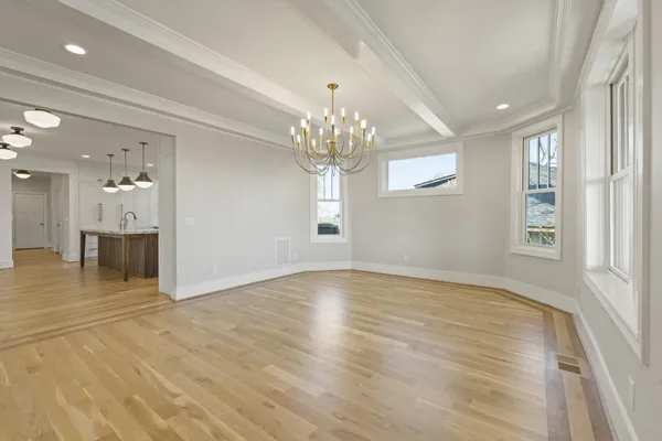 a large kitchen with cabinets and stainless steel appliances