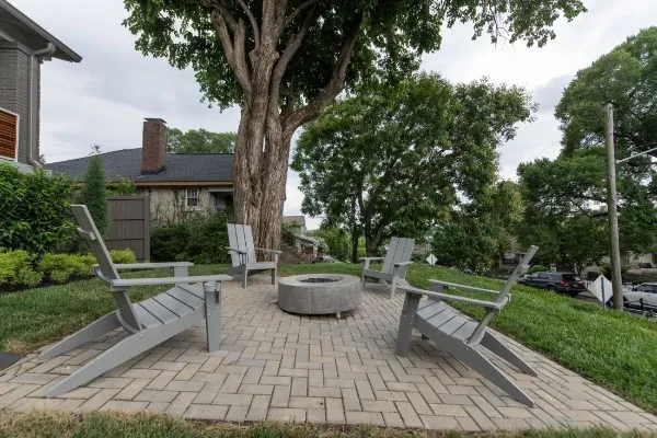 a spacious bedroom with a large bed and a chandelier
