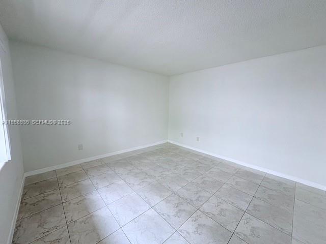 7785 Southwest 86th Street, Unit E219 Miami, FL 33143 - Photo 7 of 9 a view of an empty room