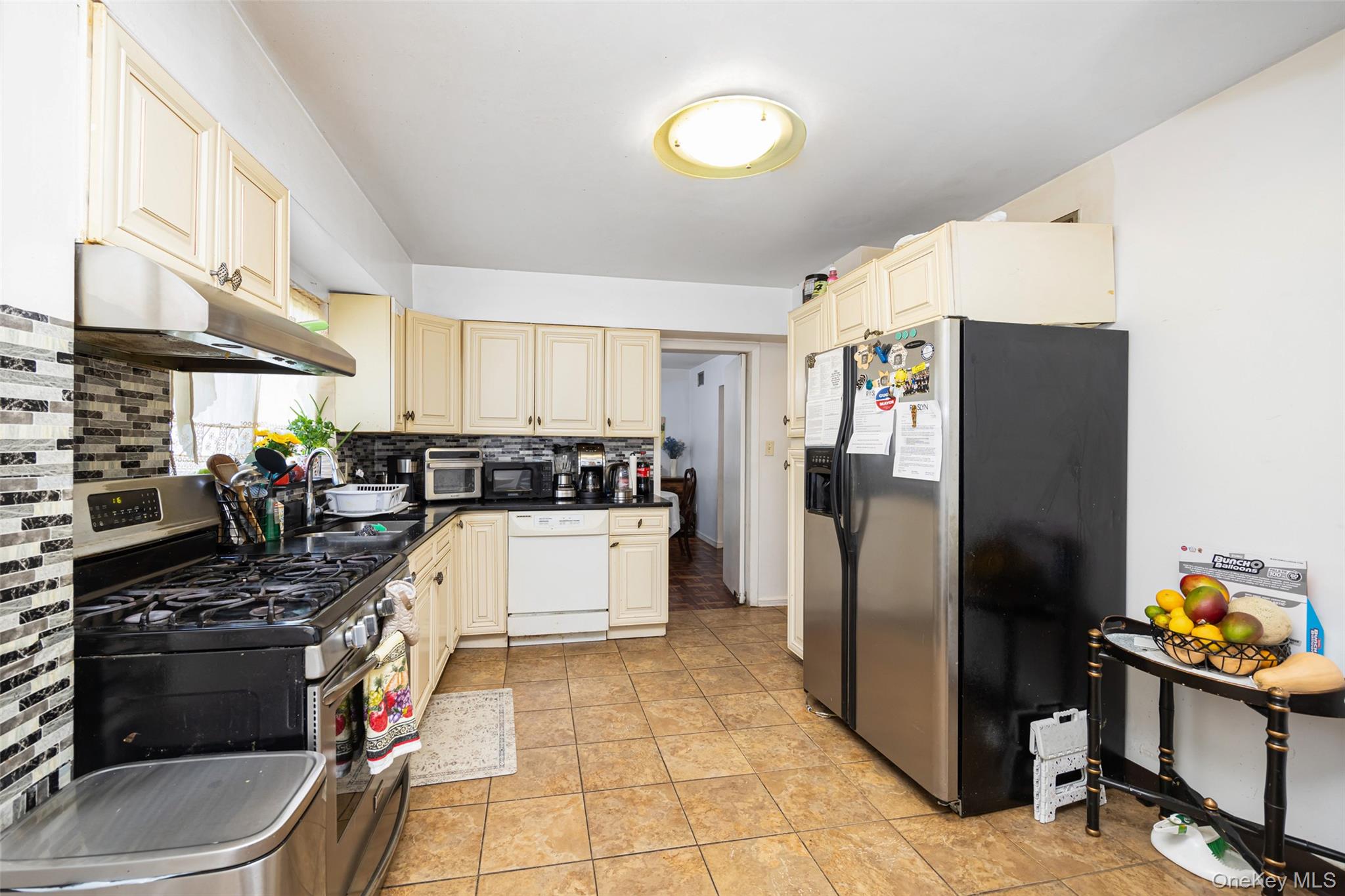 84 Middle Neck Road Roslyn, NY 11576 - Photo 11 of 44 a kitchen with a refrigerator and a stove